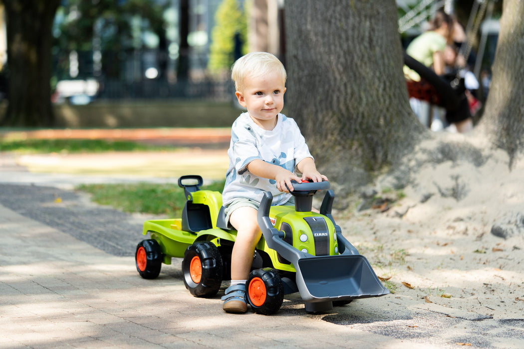 Claas Rutscher mit Heckbagger, Frontlader und Anhänger