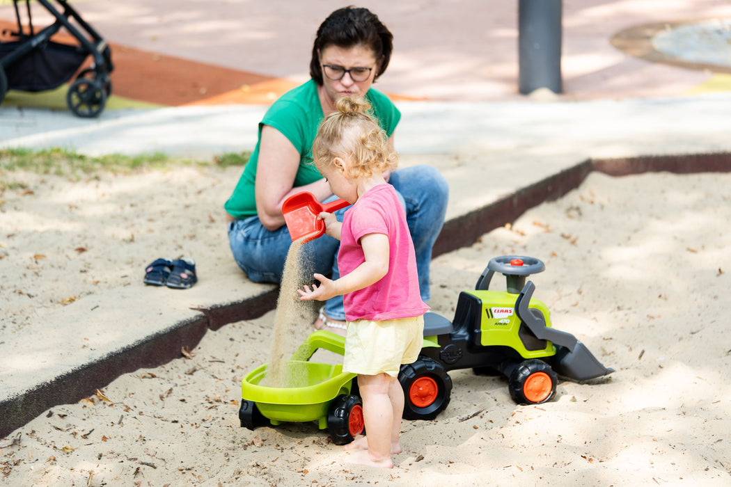 Claas Rutscher mit Heckbagger, Frontlader und Anhänger