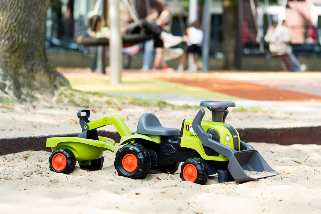 Claas Rutscher mit Heckbagger, Frontlader und Anhänger